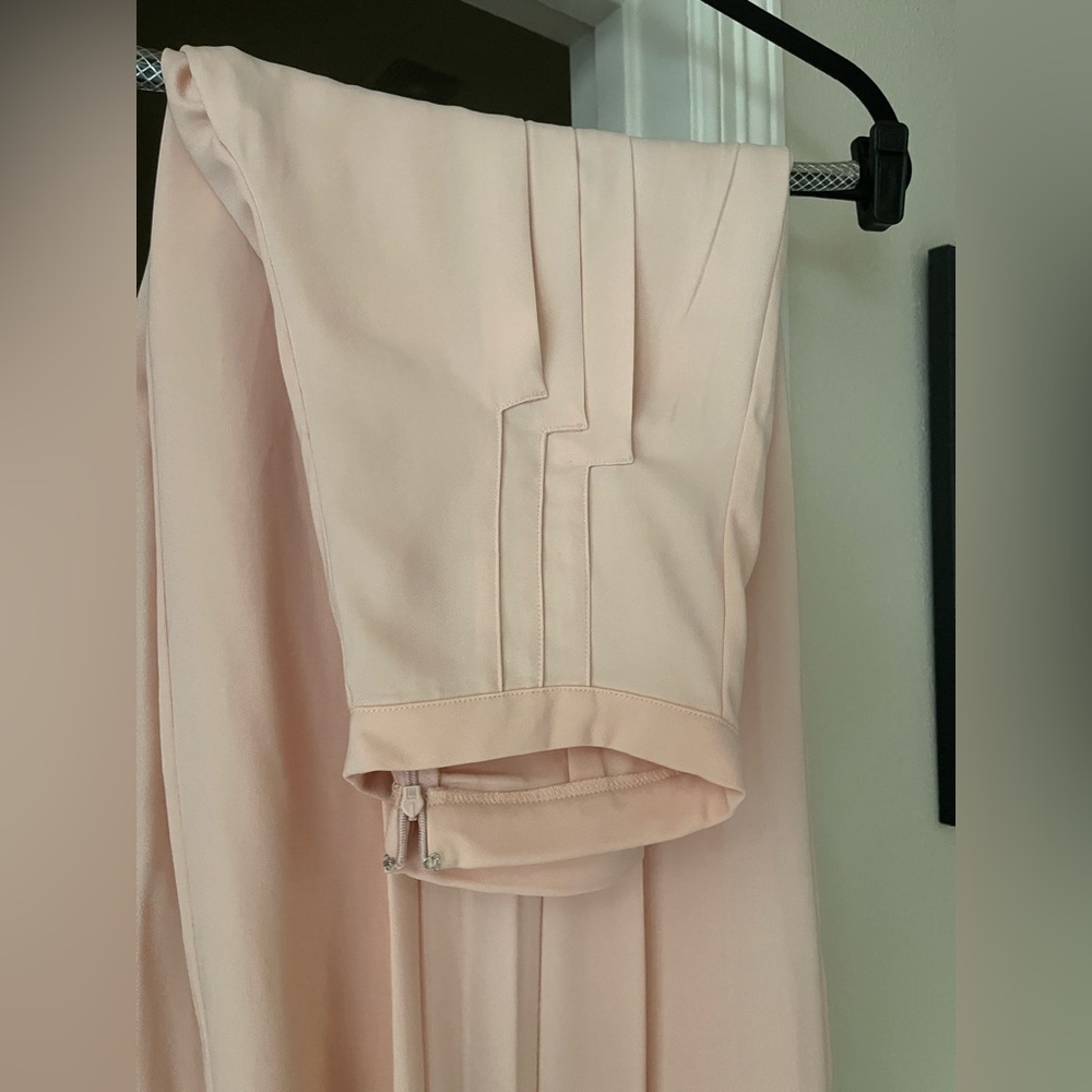Unique palazzo style pant, pale peachy-pink with front detail and a few pleats.